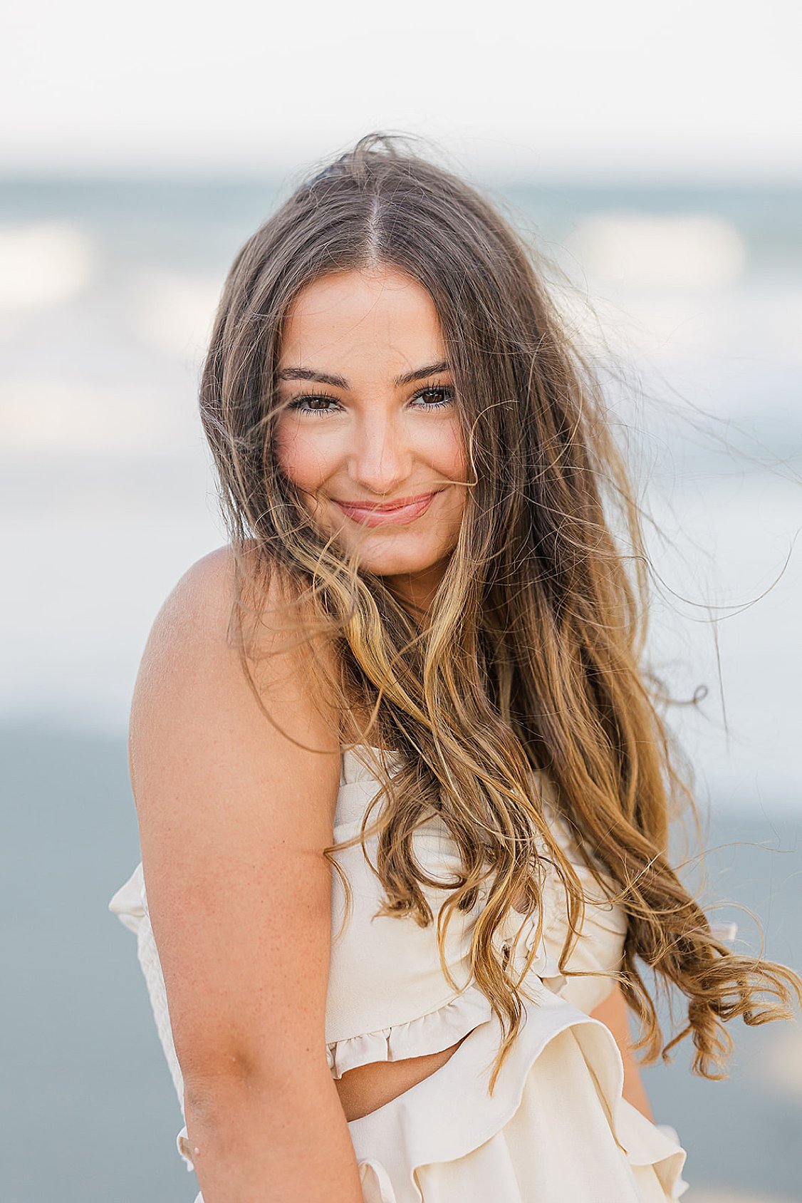Lauren’s senior session on Isle of Palms beach, Charleston, SC, with sand, waves, and sunset light.