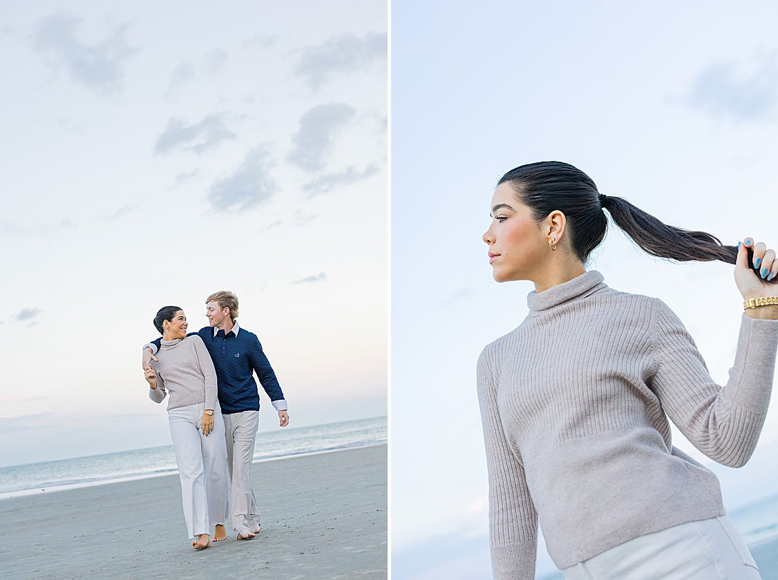 Couple walking hand in hand along Tybee Island beach at sunset, dressed in soft coastal chic attire.