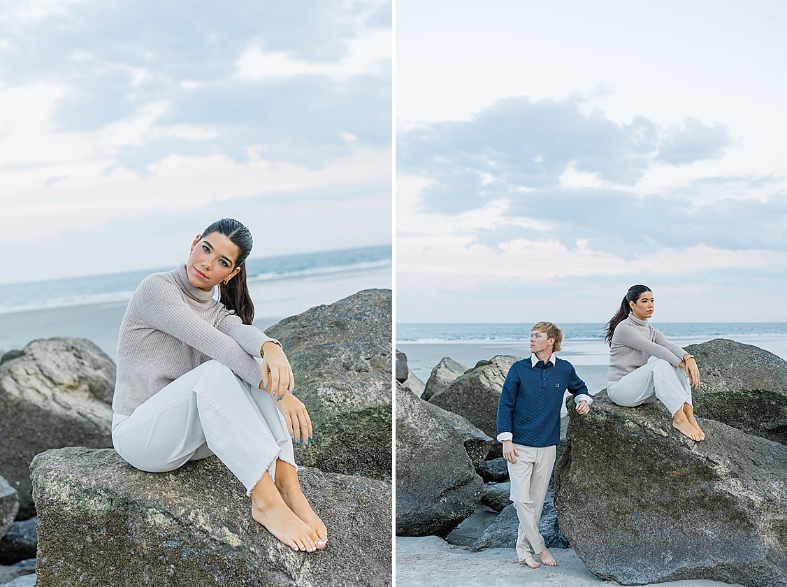 Couple walking hand in hand along Tybee Island beach at sunset, dressed in soft coastal chic attire.