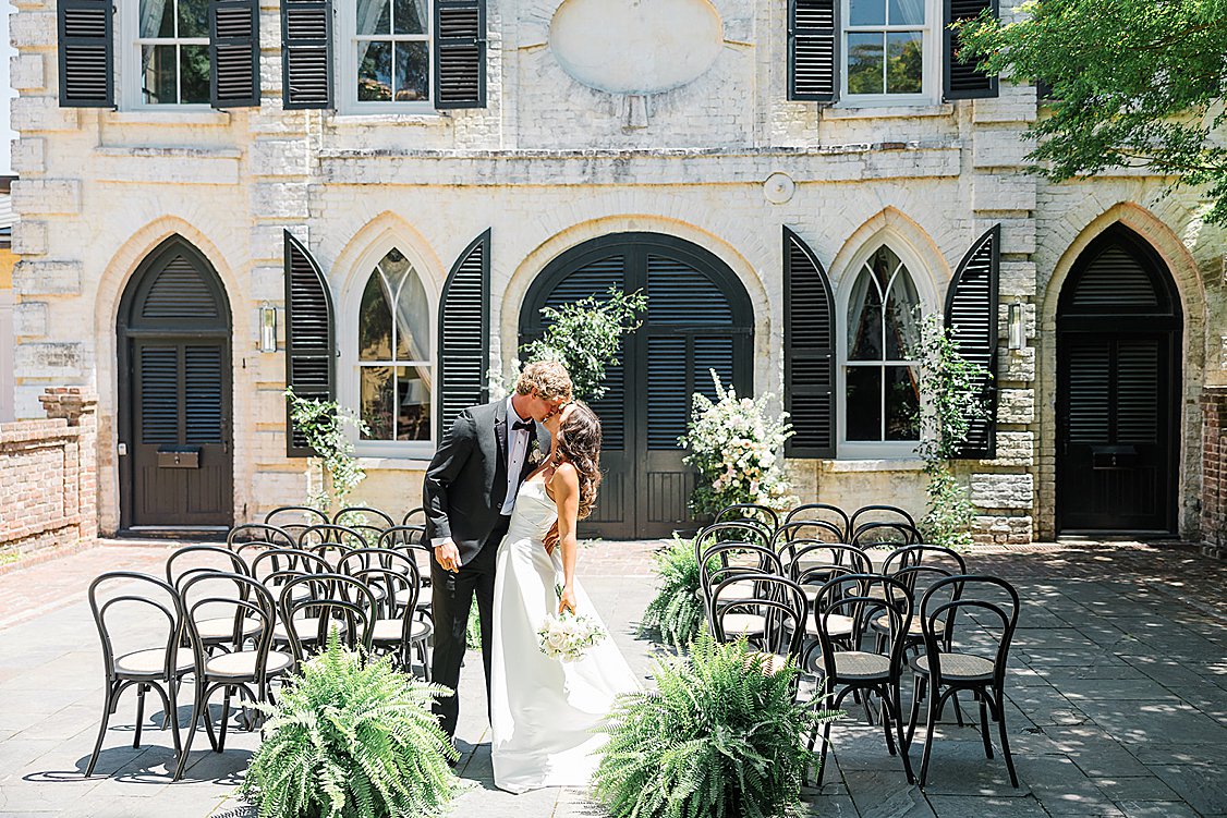 Bride in a timeless gown with soft blush accents at the William Aiken House.