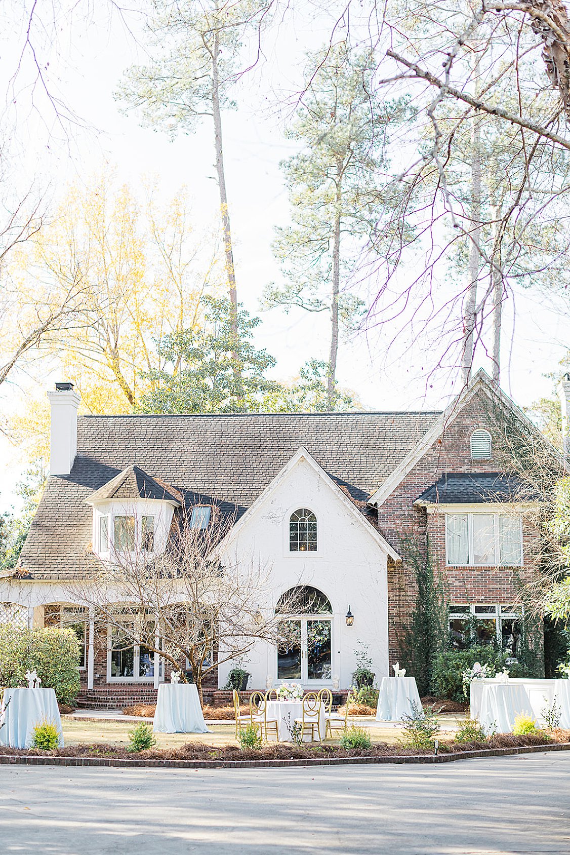 Bridgerton-inspired wedding ceremony on a private estate near Columbia, SC with pastel florals and winter greenery.